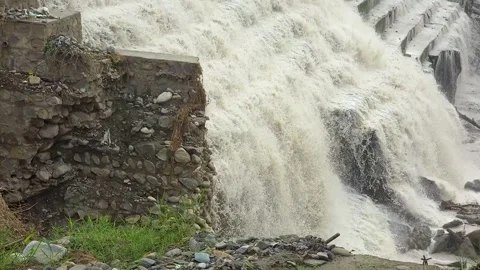 Dam water release creating flood in India Stock Footage 321042187