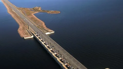 A dam on which the multi-lane highway passes Stock Footage 163716929