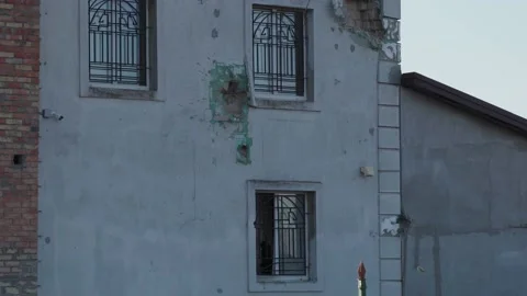 Damage to the building due to the impact of the projectile Video stock 201340168