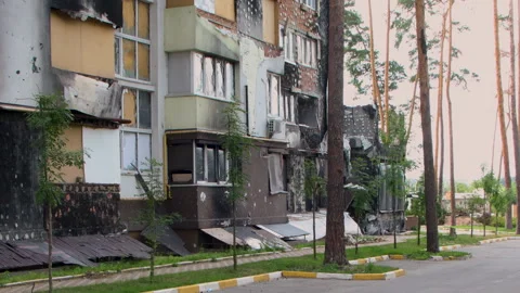 Damage to a house a year after the missile attack, Irpin, Ukraine Stock Footage 246855357