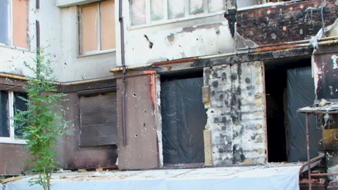 Damage to a house a year after the missile attack, Irpin, Ukraine Stock Footage 246856404