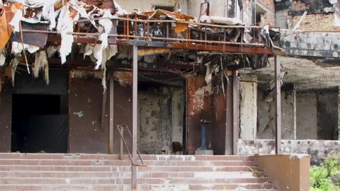 Damage to a house a year after the missile attack, Irpin, Ukraine Stock Footage 246856697