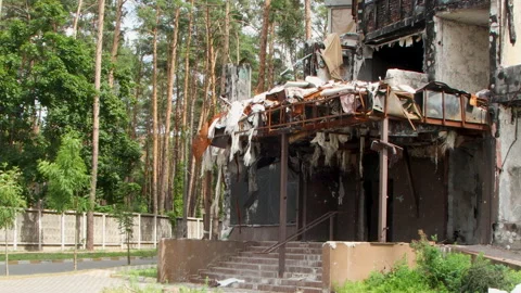 Damage to a house a year after the missile attack, Irpin, Ukraine Stock Footage 246856842
