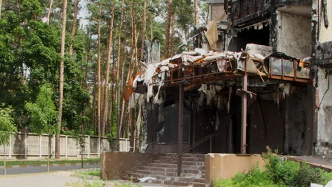 Damage to a house a year after the missile attack, Irpin, Ukraine Stock Footage 246857030