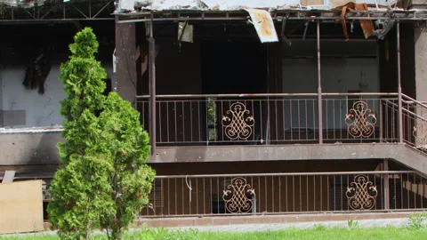 Damage to a house a year after the missile attack, Irpin, Ukraine Stock Footage 246857045