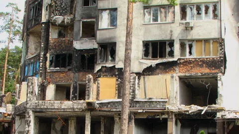 Damage to a house a year after the missile attack, Irpin, Ukraine Stock Footage 246858680