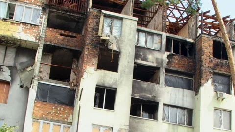 Damage to a house a year after the missile attack, Irpin, Ukraine Stock Footage 246858897