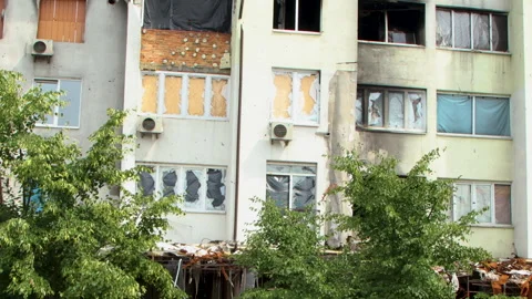 Damage to a house a year after the missile attack, Irpin, Ukraine Stock Footage 246859541