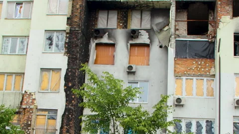 Damage to a house a year after the missile attack, Irpin, Ukraine Stock Footage 246859993
