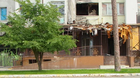Damage to a house a year after the missile attack, Irpin, Ukraine Stock Footage 246860449
