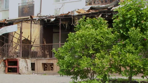 Damage to a house a year after the missile attack, Irpin, Ukraine Stock Footage 246860687
