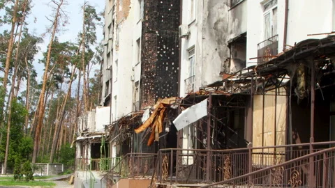 Damage to a house a year after the missile attack, Irpin, Ukraine Stock Footage 246860776