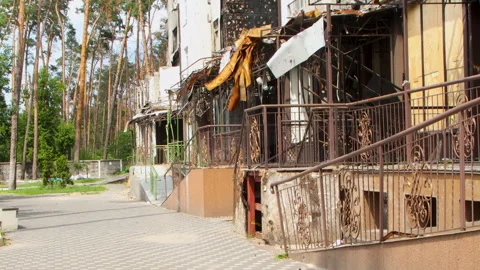 Damage to a house a year after the missile attack, Irpin, Ukraine Stock Footage 246860795