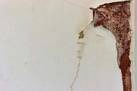 Damage to painted plaster wall caused by damp Stock Photos