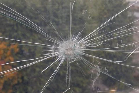 Damage to plexiglass from a strong impact Stock Photos