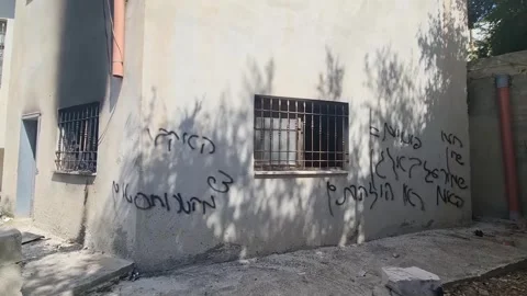 Damage reported at mosque in West Bank after suspected settler arson, Bezariya,  Stock Footage 344302542