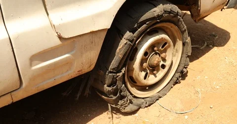 Damage tire on the side of the road Video stock 75964711