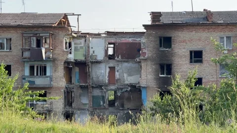 Damaged and burnt out multi-storey houses in Ukraine, Horenka. Genocide Stock Footage 205230814