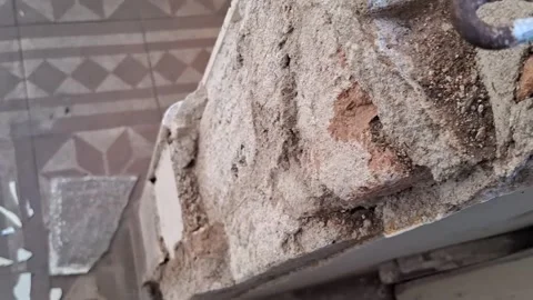 Damaged architectural brick pillar with shattered glass shards video footage Stock Footage 337897059