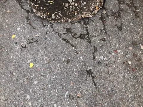 Damaged asphalt road with potholes Stock Footage 77270308
