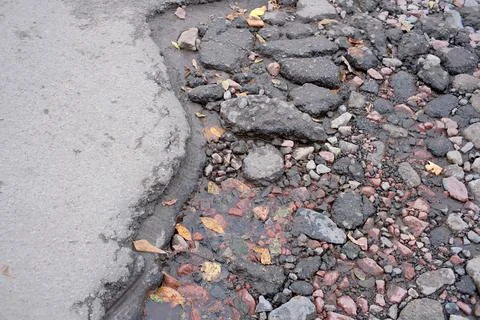 Damaged asphalt road surface Foto stock