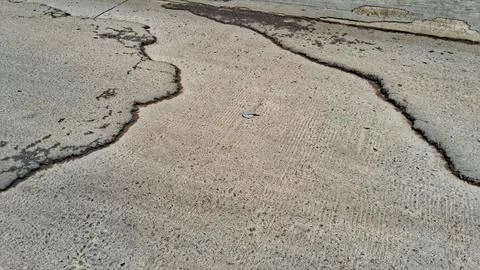 Damaged to the asphalt road surface Stock Photos