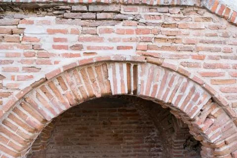 Damaged brick wall arcade - old wall construction architecture weathered Stock Photos