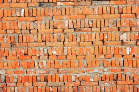 Damaged brick wall Stock Photos