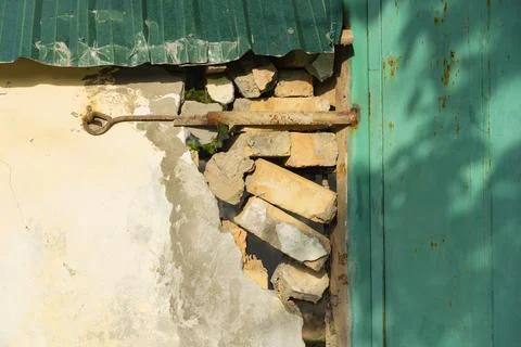 Damaged Brick Wall with Rust and Decay 写真素材
