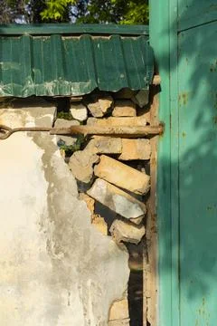 Damaged Brick Wall with Rust and Decay Stock Photos