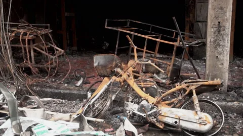 Damaged building after the fire . Burnt down buliding in city. Video stock 202983957