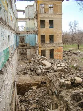 Damaged building, likely due to explosion or demolition Scattered concrete .. Stock Photos