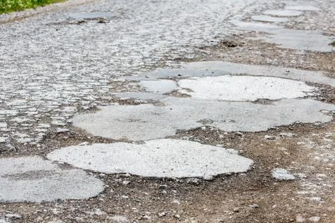 Damaged bumpy road Foto stock