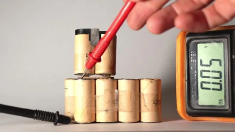 Damaged Capacitor Voltage Check with Multimeter Stock Footage 319494091