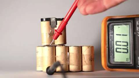 Damaged Capacitor Voltage Check with Multimeter Stock Footage 319494121