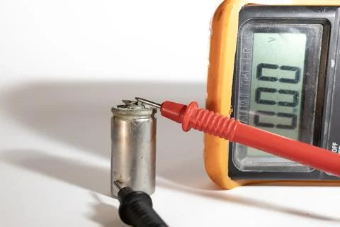 Damaged Capacitor Voltage Check with Multimeter Stock Photos