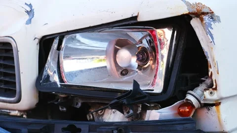 Damaged Car Front with Broken Headlight and Turn Indicator Bulb Stock Footage 155716604