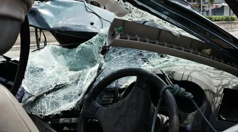 Damaged car front destroyed window broken glass accident 库存照片
