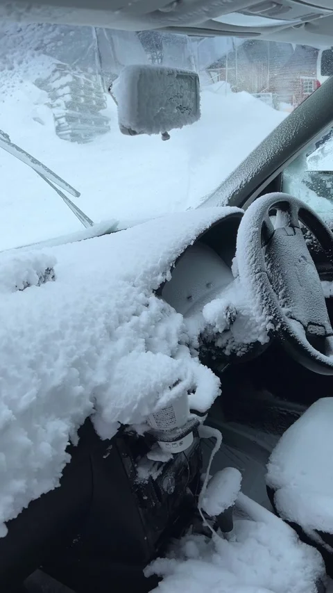 Damaged car interior covered with deep fresh winter snow Stock Footage 328716035