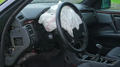 Damaged Car Interior with Deployed Airbag after Road Crash Accident  Stock Footage 320424256