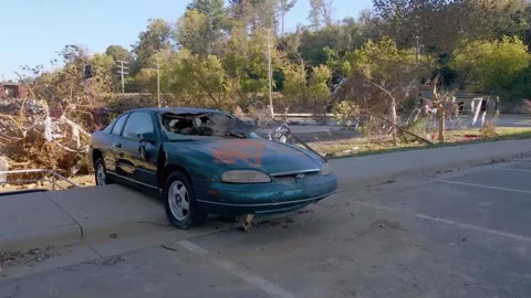 A damaged car left in the wake of Hurricane Helene Stock Footage 287996033