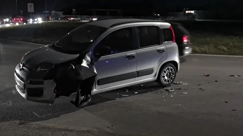 Damaged car in the middle of the road blocks traffic Stock Footage 102054982