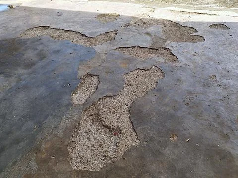 Damaged cement floor in the yard Stock Photos