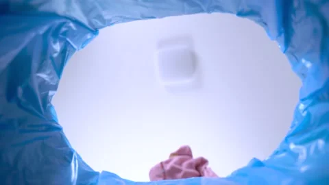 Damaged clothes fall into trash bucket with blue recyclable bag, bottom view Stock Footage 141052152