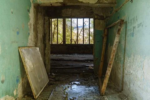 Damaged corridor in an abandoned building Stock Photos