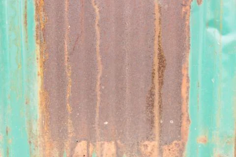 Damaged corrugated metal rusted surface background Stock Photos