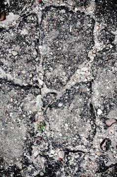 Damaged cracked asphalt pattern texture Stock Photos