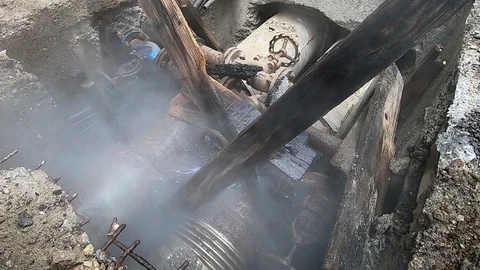Damaged district heating pipeline with hot water leaking 動画素材 87996439