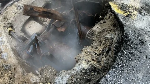 Damaged district heating pipeline with hot water leaking Stock Footage 88003052