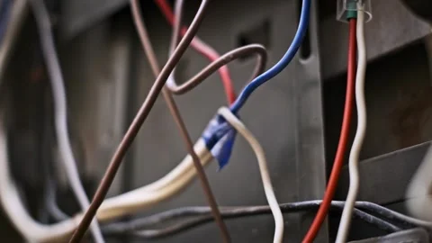 Damaged Electrical Wiring: Close-Up on Exposed and Burnt Wires Видео 274530787